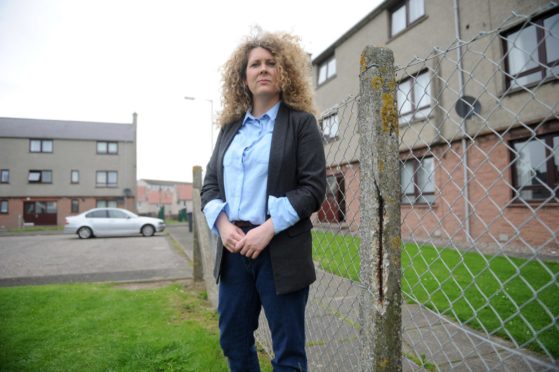 Cllr Speed outside former Arbroath council housing which underwent a multi-million pound redevelopment. Image: Kim Cessford/DC Thomson