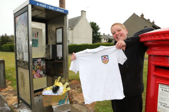 Carmen at the phone box when she launched the donation point.