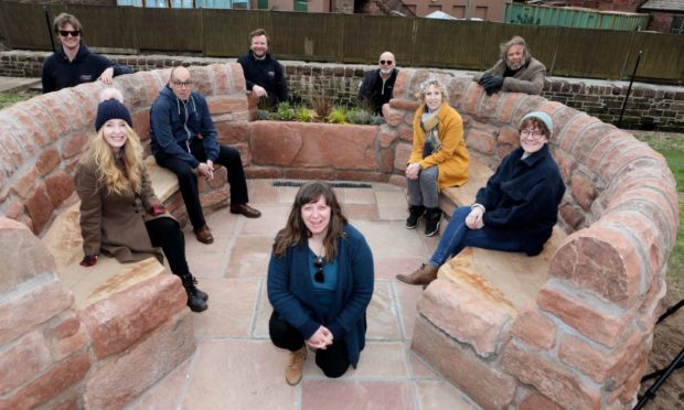 FOTRA chairwoman Morag Smith front) with those involved in the seating project.