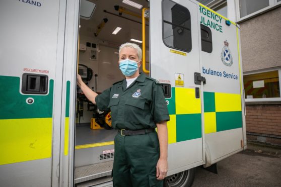 Telegraph News - Dundee - Sheanne Mulholland story - CR0027189 - Dundee paramedic lead Amanda Burnett is speaking out about her experiences of the pandemic on her job as a paramedic and the emotional toll it has taken on her and her team. Picture shows; paramedic lead Amanda Burnett outside the Ambulance Depot, West School Road, Dundee, 23rd March 2021, Kim Cessford / DCT Media.