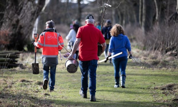 Volunteers taking part in tree planting at Hospitalfield House.