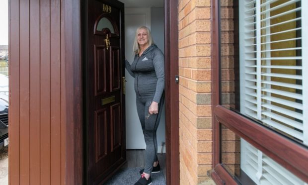 Karen Longmuir with her new front door