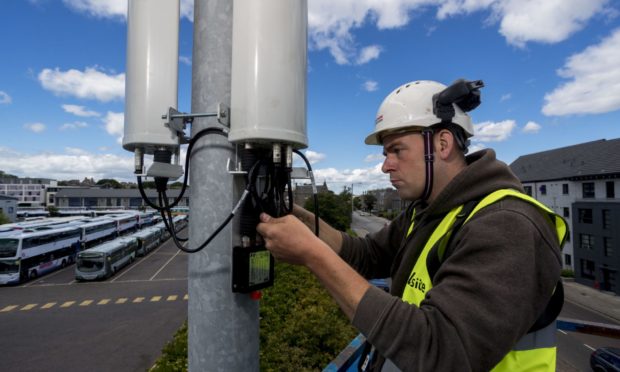 A technician with a 5G mobile mast.