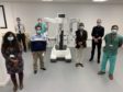 The new robot with staff at Ninewells Hospital