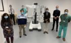 The new robot with staff at Ninewells Hospital
