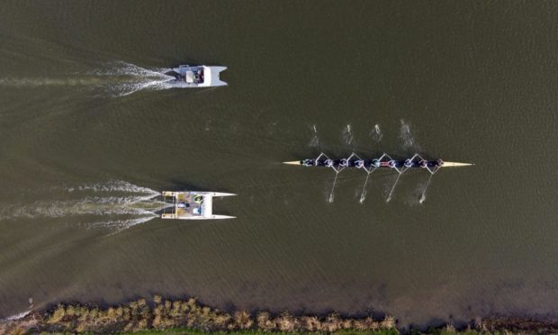 Cambridge University Boat Club women's crew train on the River Great Ouse near Ely in Cambridgeshire ahead of the 2021 Boat Race. Picture date: Wednesday March 25, 2021. PA Photo. The 2021 Boat Race will be staged in Ely for the first time since 1944. Photo credit should read: Joe Giddens/PA Wire.
