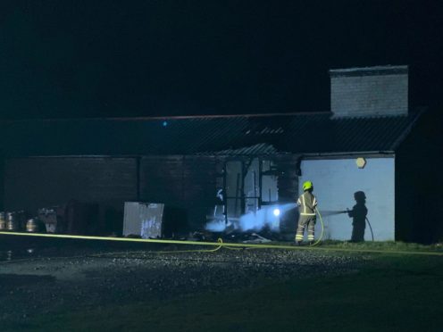 Fire crews extinguish the blaze at the Rosyth Sharks Rugby Club.