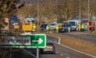 Emergency services at the scene of the crash near Auchterarder