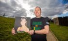 Tommy Swan with photograph of step-daughter Jodie McNab.