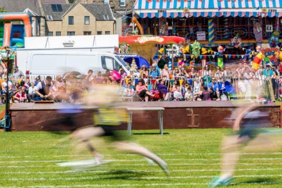 Sprinters race across the finish line at the 2019 Burntisland Highland Games.