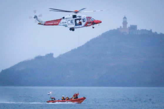 Kinghorn lifeboat crew and coastguard helicopter