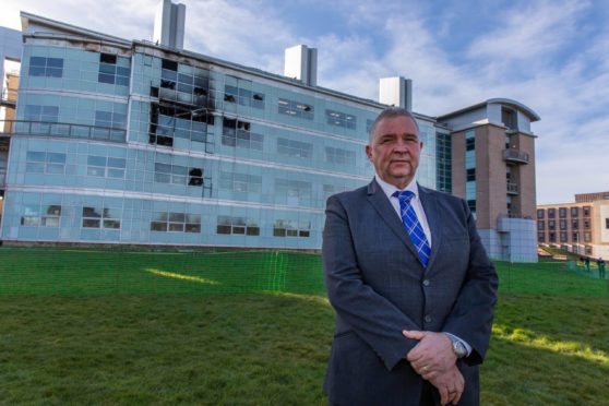 Questor and Factor of St Andrews University, Derek Watson, pictured not long after the fire at the university's science labs. Hopes are high work to have the building back up and running by the middle of 2022.