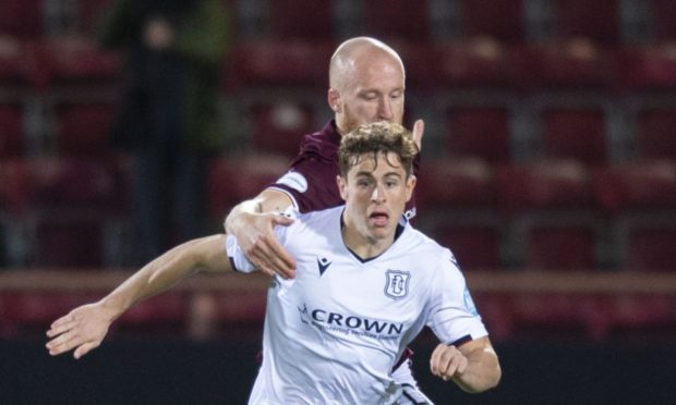 Dundee midfielder Fin Robertson in action against Hearts.