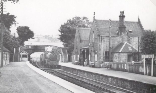 A steam locomotive arriving at Beauly station, which had one of the private waiting rooms on the Highland Railway. Provided by the Highland Railway Society.