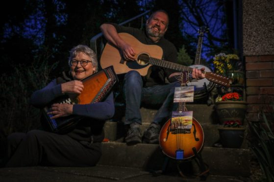 Dolly and Mike O'Rourke with some of their instruments. Monday 22nd March, 2021. Mhairi Edwards/DCT Media