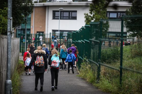 The car ban could see more children walking to school. Pictured is children walking to Blairgowrie Community Campus, last year.