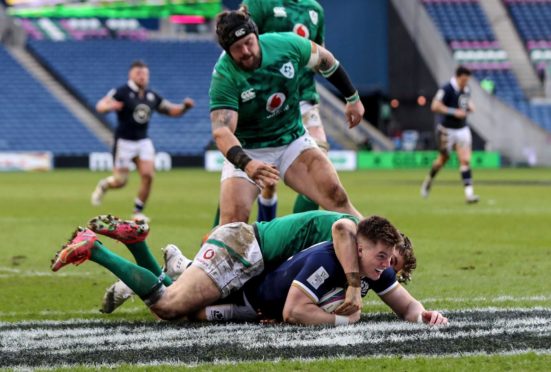 Huw Jones scores his 11th try for Scotland on Sunday.