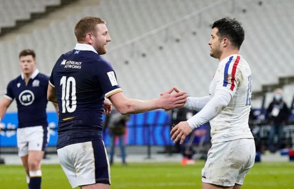 Finn Russell and Brice Dulin after the clash which brought Russell's red card in Paris.