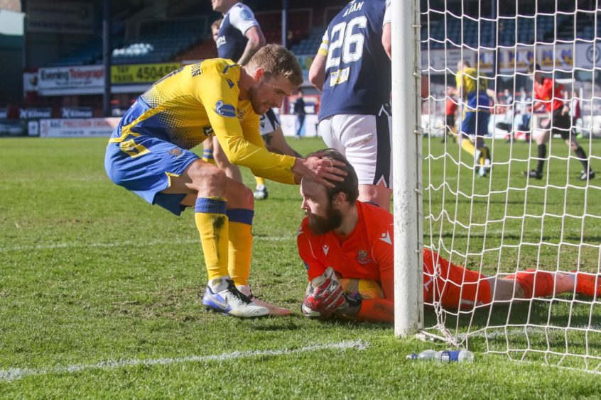 David Wotherspoon congratulates Zander Clark on his penalty save at Dens Park. 