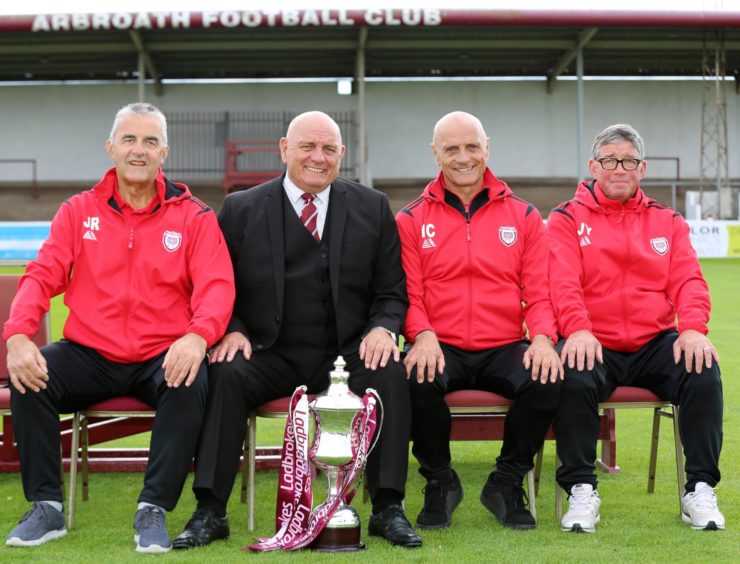 Dick Campbell sitting with John Ritchie and other Arbroath FC staff
