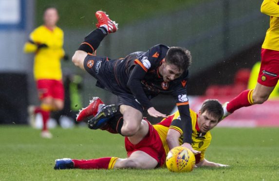 Liam Smith of Dundee United is challenged by former Jag Steven Saunders in one of last season's Champions hipclashes.