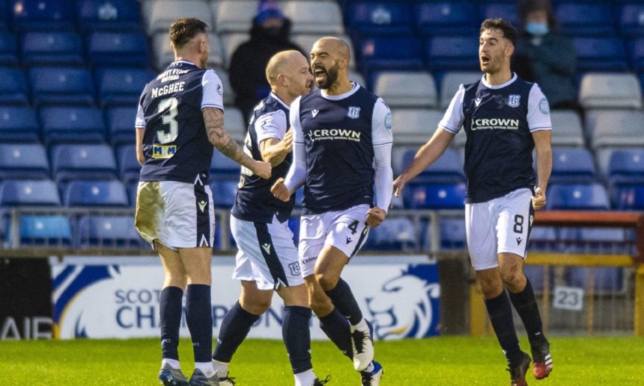 Liam Fontaine celebrates as Dundee head for promotion.