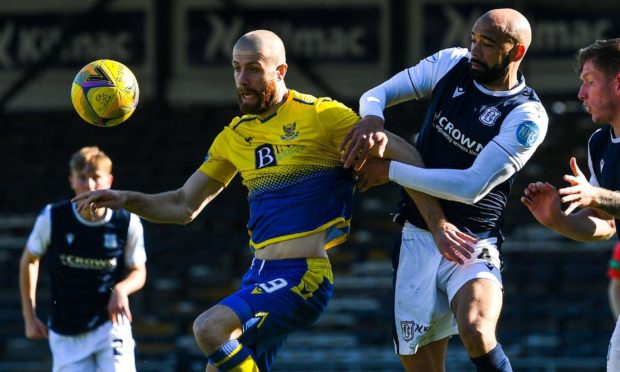 Dundee defender Liam Fontaine wrestles with St Johnstone right-back Shaun Rooney in their Scottish Cup clash at Dens on Saturday.