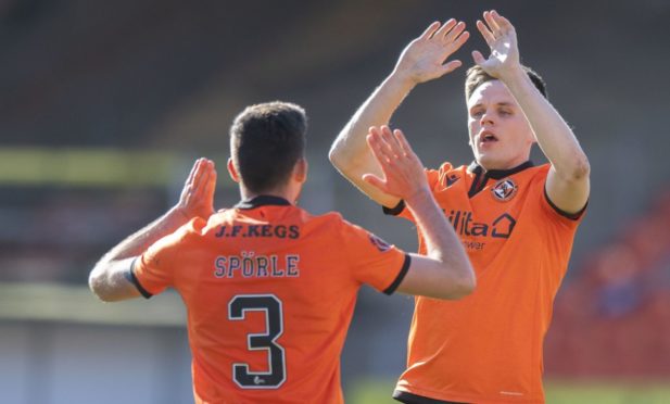 Dundee United striker Lawrence Shankland (right) celebrates his equaliser with Adrian Sporle.