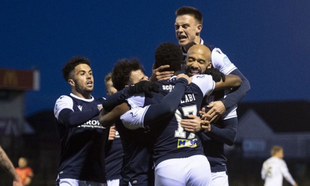 Dundee players celebrate Jonathan Afolabi's goal as they won at Ayr.