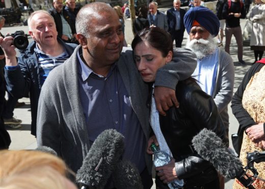 Postmaster Harjinder Butoy and wife Balbinder following the Horizon ruling.