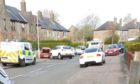 Three cars were damaged after a white car ploughed into the parked vehicles.