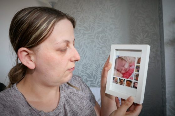 Evening telegraph/ Courier Dundee news CR0027892   G Jennings pics , Nicola Duncan (35) Glenconnor Drive Dundee, with a picture of her new baby Willow who is terminally ill, and is in HDU Ninewells, tuesday 28th April.