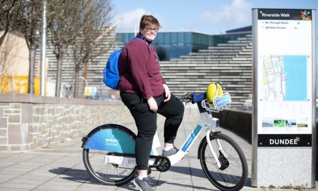 Leah Hall on an e-bike on Riverside Walk in Dundee.