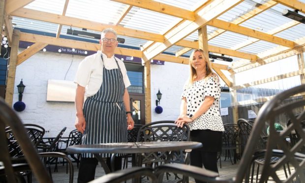 Chef Alastair Campbell and Royal Hotel manager Donna Hughes on the roof terrace.