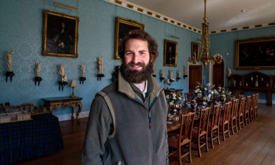 William, Viscount Stormont, in Scone Palace next to long dining table