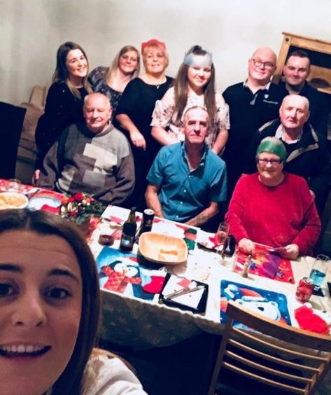 Keith celebrating Christmas with his family.