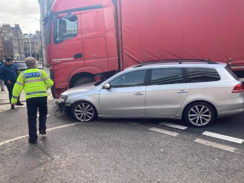 Police were called to a collision between a lorry and a car in the city centre.