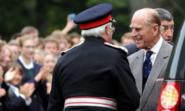 Author Grenville Johnston (left) welcomes Prince Philip to Gordonstoun School in 2014