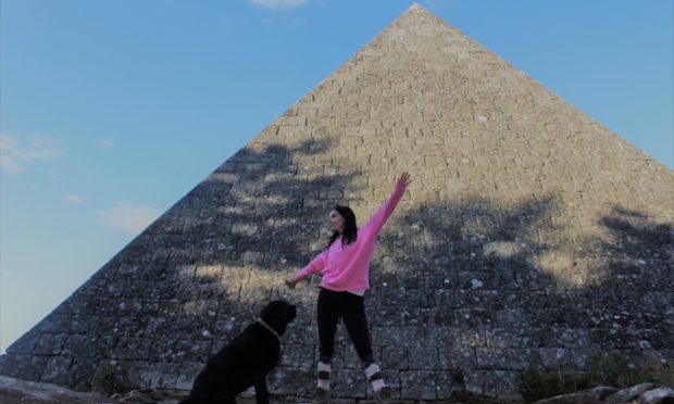 Gayle and her dog Toby at Prince Albert's cairn on the Balmoral estate.