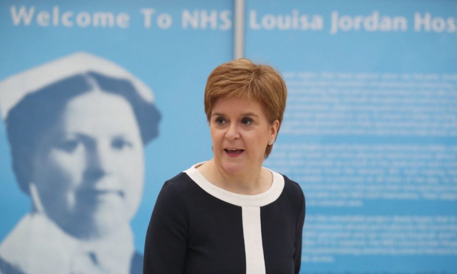 First Minister Nicola Sturgeon during a visit to the NHS Louisa Jordan at the SEC, Glasgow, to learn about the venue being adapted for treating outpatients. PA Photo. Picture date: Monday July 27, 2020. See PA story SCOTLAND Coronavirus. Photo credit should read: Andrew Milligan/PA Wire