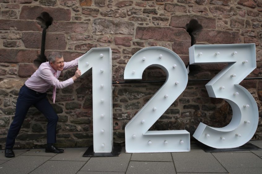 Scottish Liberal Democrat Leader Willie Rennie with giant numbers at the Vennel Viewpoint of Edinburgh Castle, Edinburgh, where he announced his party's pupil premium plans while campaigning for the Scottish Parliamentary election. Picture date: Sunday March 28, 2021. PA Photo. See PA story SCOTLAND Election. Photo credit should read: Andrew Milligan/PA Wire