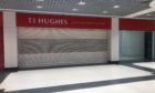 To go with story by James Simpson. TJ Hughes and Wellgate Centre refuse to comment on stores future. Picture shows; TJ Hughes shutters remain down despite lockdown measures easing.. Wellgate Centre Dundee.. James Simpson/DCT Media Date; 27/04/2021