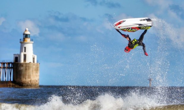 Ant Burgess practices his freestyle on a jet ski at Blyth beach in Northumberland, on the North East coast. Picture date: Saturday April 10, 2021. PA Photo. Photo credit should read: Owen Humphreys/PA Wire