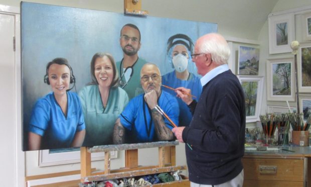 St Andrews artist Alan Stephens finishing his NHS Heroes portrait