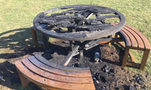 The damaged table and scorched grass in Magdalen Green.