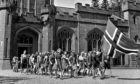 Norwegian children proudly march with their national flag at Drumtochty Castle - their refuge and school during the Second World War.