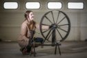 Project Conservator Lyndsay MacKinnon with a spinning wheel, 1770. Thursday 1st April, 2021. Mhairi Edwards/DCT Media