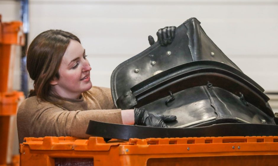 Black leather-bound ploughing saddle made by Drysdale, Dundee.