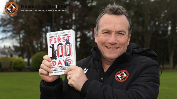 Dundee United manager Micky Mellon poses with his management book: The First 100 Days.