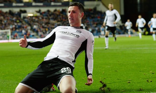 Michael O'Halloran slides in celebration after scoring St Johnstone's third to beat Rangers in 2015.